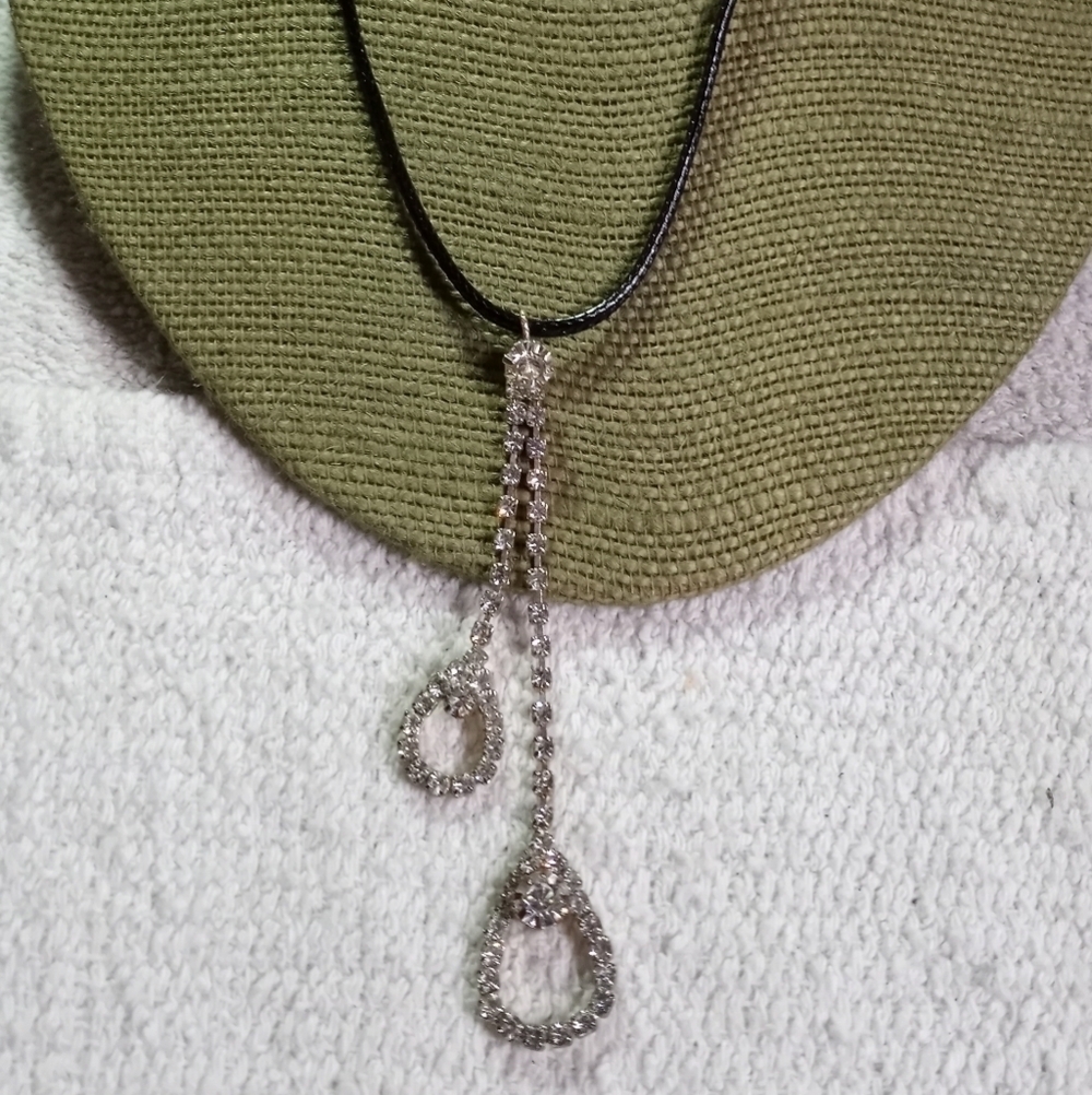 Long dangle rhinestone pendant on black cord necklace